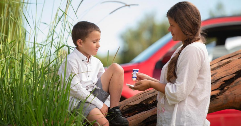 Boy using wound healing Manuka honey