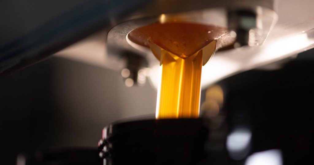 Honey poured into jar by solar energy powered machine